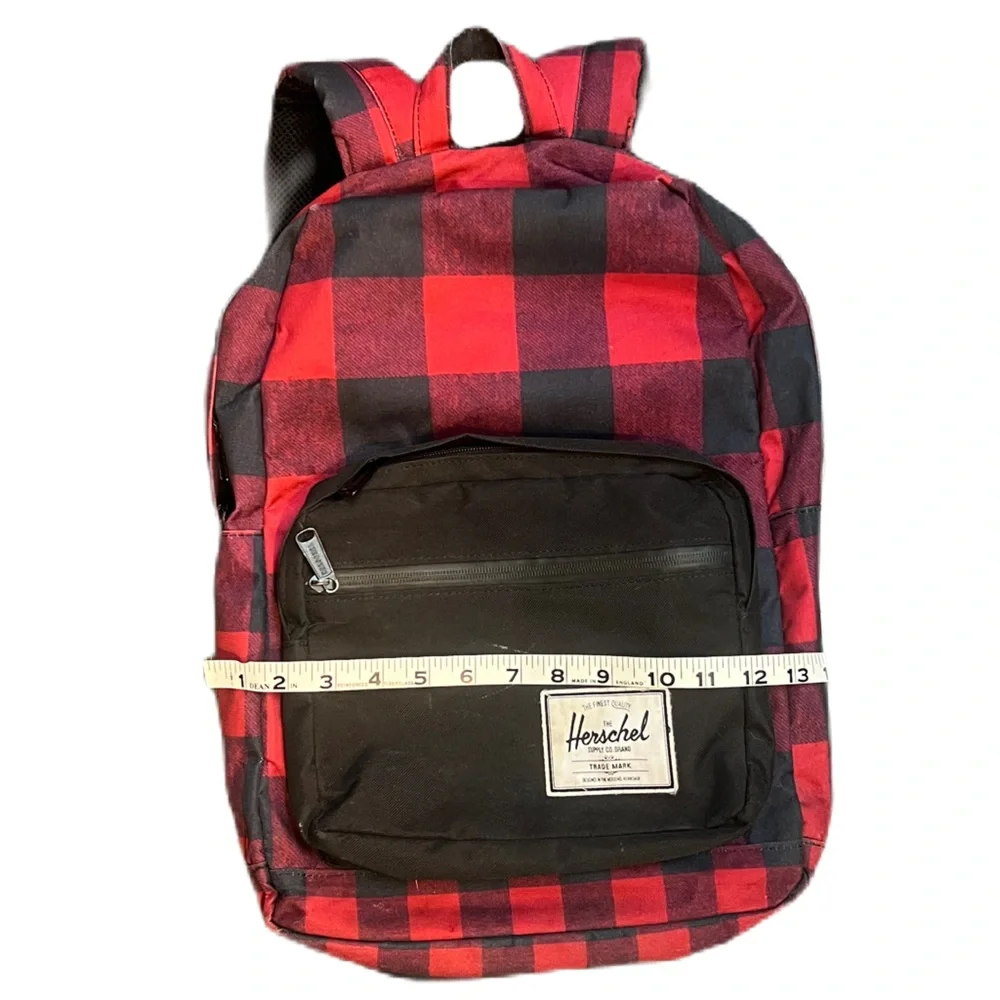 Herschel Supply Co. Pop Quiz backpack in a red and black buffalo plaid pattern.